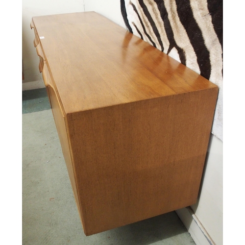 86 - A mid 20th century teak A.H. McIntosh of Kirkcaldy sideboard with pair of cabinet doors by three dra... 