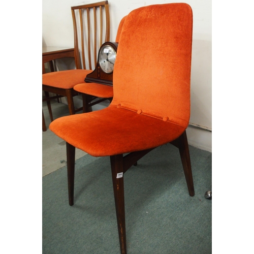 88 - A pair of mid 20th century teak framed dining chairs with orange upholstery and a mahogany mantle cl... 