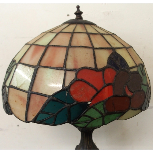 89 - A 20th century tiffany style table lamp with cast metal base, 56cm high