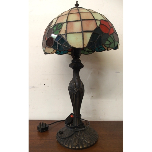 89 - A 20th century tiffany style table lamp with cast metal base, 56cm high