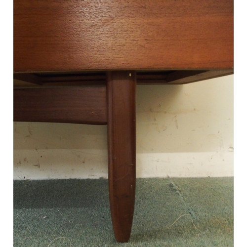 90 - A mid 20th century stained teak Portwood sideboard with two pairs of cabinet doors over four drawers... 