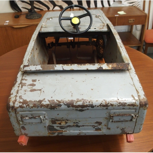 97 - A mid 20th century tin plate child's pedal car, 43cm high x 107cm long x 44cm wide