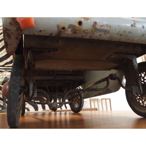 97 - A mid 20th century tin plate child's pedal car, 43cm high x 107cm long x 44cm wide