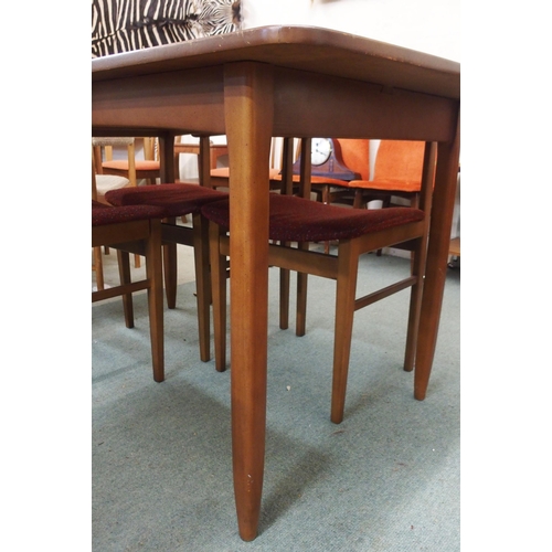 98 - A mid 20th century stained teak extending dining table, 75cm high x 138cm long x 81cm deep and four ... 