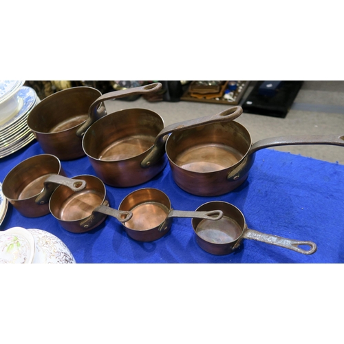 216 - A graduated set of seven copper pans, together with another pan, a Doulton dish and a waterlily pain... 