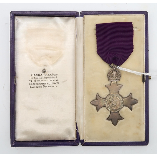 366 - A silver M.B.E. medal by Garrard & Co., London, 1919, in purple Morocco leather fitted box