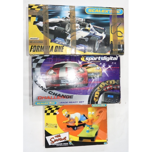 421 - Three boxed Scalextric sets (Sports Digital: Lane Change Challenge, Formula One and Simpsons Skatebo... 