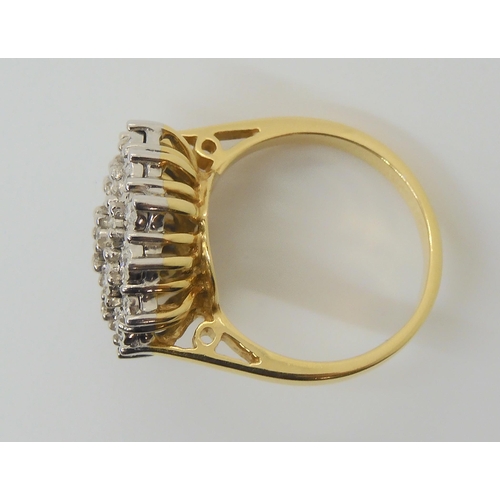 601 - An 18ct gold illusion set diamond cluster ring, set with estimated approx 0.30cts of brilliant cut d... 