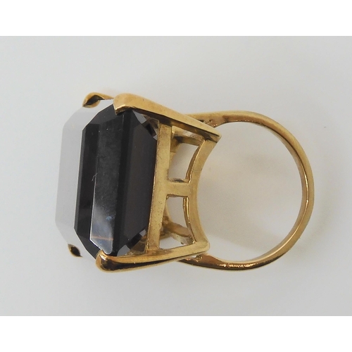 604 - A 9ct gold ring set with a very large smoky quartz, 2.5cm x 1.7cm, finger size approx J, weight 12.4... 