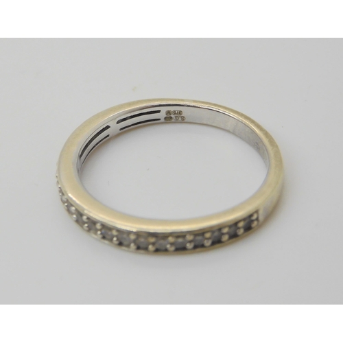 606 - A 9ct white gold diamond set eternity ring set with estimated approx 0.20cts of brilliant cut diamon... 