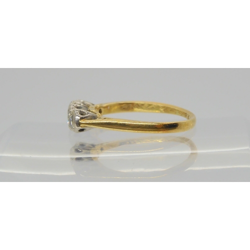 617 - An 18ct gold four stone diamond ring, set with estimated approx 0.25cts of brilliant cut diamonds, s... 