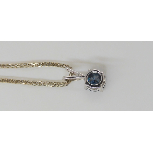 633 - A 9ct white gold blue diamond pendant of estimated approx 0.70cts, with matching ear studs of estima... 