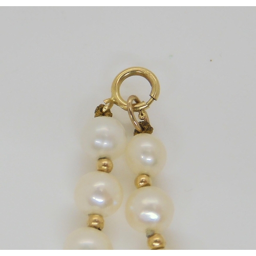 638 - A string of pearls with interspaced gold beads and a 9ct clasp, with matching bracelet and earrings,... 