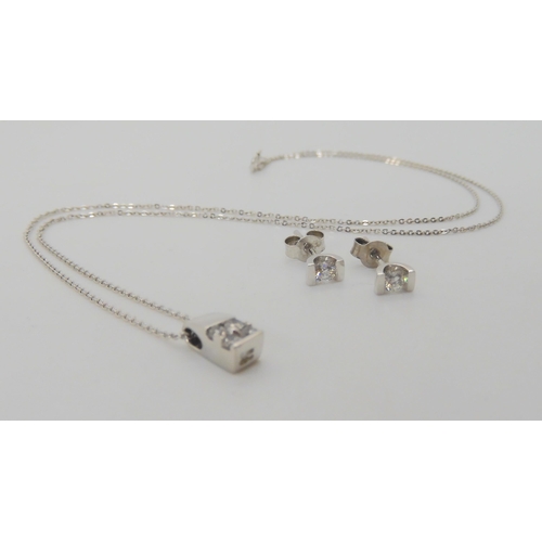 644 - An 18ct gold diamond pendant and 9ct white gold diamond earrings, the pendant set with estimated app... 