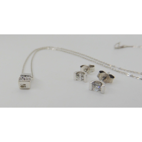 644 - An 18ct gold diamond pendant and 9ct white gold diamond earrings, the pendant set with estimated app... 