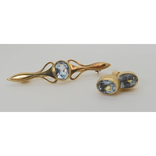 645 - A yellow metal aquamarine brooch with matching earrings, weight 6.7gms