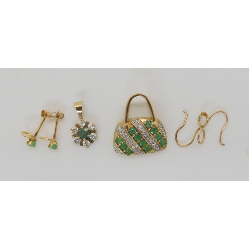 648 - A 9ct gold emerald and diamond set handbag shaped pendant, a emerald and cz flower pendant, and emer... 