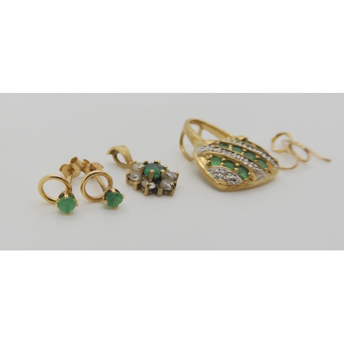 648 - A 9ct gold emerald and diamond set handbag shaped pendant, a emerald and cz flower pendant, and emer... 