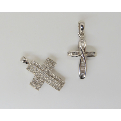 650 - A 9ct gold baguette diamond set cross, length 3cm, together with a further 9ct eight cut diamond set... 