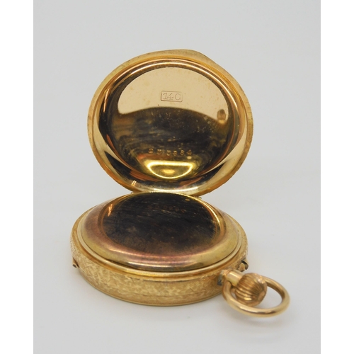 662 - A 14k gold open face fob watch, with gold coloured dial. Diameter 3.3cm, weight including mechanism ... 