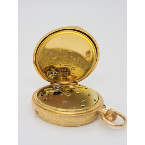 662 - A 14k gold open face fob watch, with gold coloured dial. Diameter 3.3cm, weight including mechanism ... 