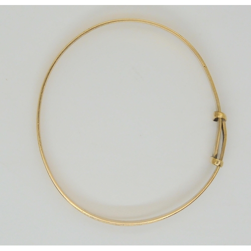 670 - A 9ct gold child's Christening bangle, max inner diameter 5.5cm, weight 6.7gms 