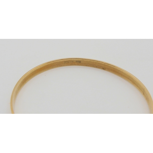 670 - A 9ct gold child's Christening bangle, max inner diameter 5.5cm, weight 6.7gms 