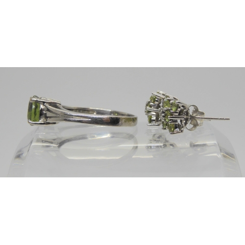 672 - An 18ct white gold demantoid garnet ring size P1/2, weight 3.7gms, together with a pair of 9ct white... 