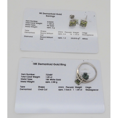 672 - An 18ct white gold demantoid garnet ring size P1/2, weight 3.7gms, together with a pair of 9ct white... 