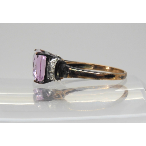 678 - A 9ct rose gold kunzite and diamond ring, size P1/2, weight 3.4gms, with Rocks & Co certificate