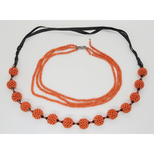 681 - A string of statement woven coral beads, with black glass beads and ribbon strap. Each woven bead is... 