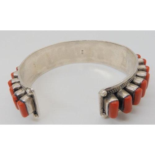 683 - A silver coral set bangle