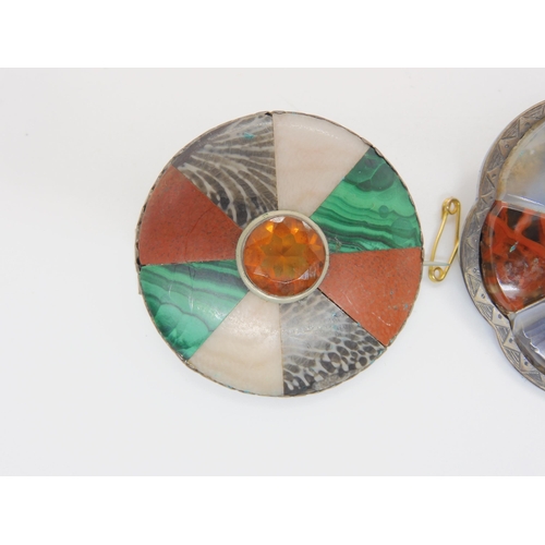 687B - Two white metal Scottish agate and fossil inlaid brooches, and a further silver example set with car... 