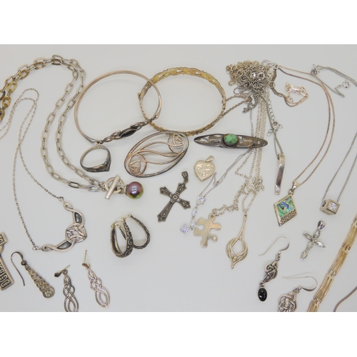 688B - A collection of silver and white metal items to include chains and pendants