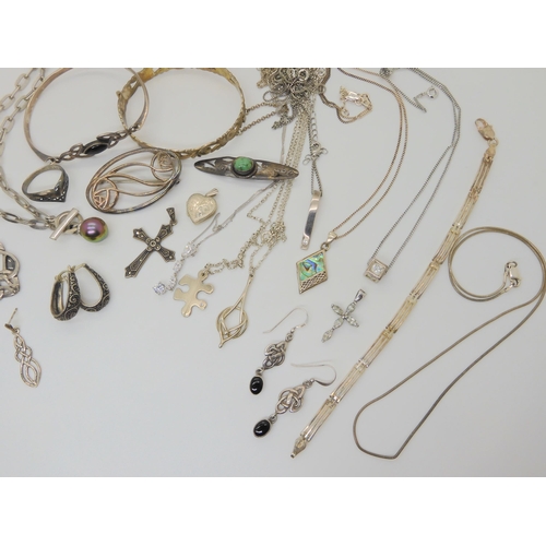 688B - A collection of silver and white metal items to include chains and pendants