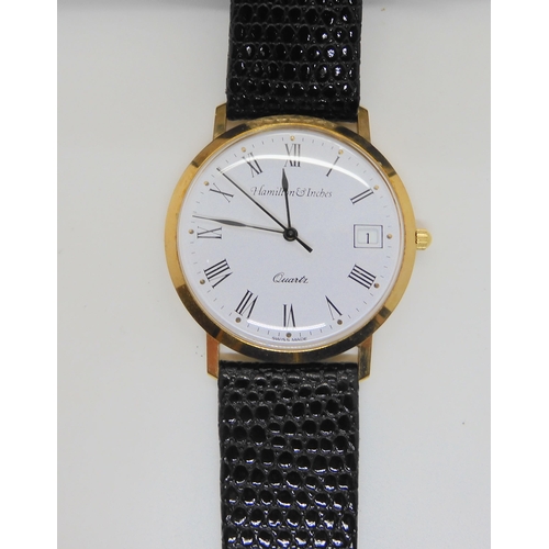 690A - A 9ct gold gents Hamilton & Inches watch, weight including strap and quartz mechanism 22.7gms, t... 