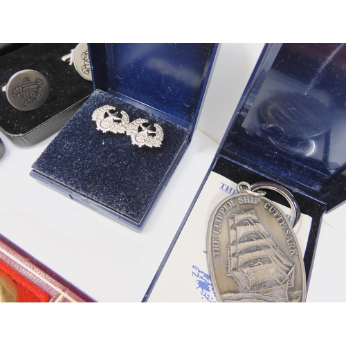 694 - A petit point handbag, a pair of Gordon Highlanders cufflinks, Michelin cufflinks (2 pairs) and othe... 