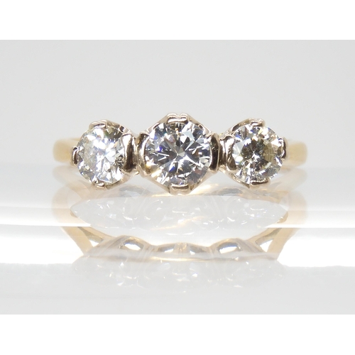 758 - An 18ct gold three stone diamond ring, set with estimated approx 1ct of brilliant cut diamonds. Fing... 