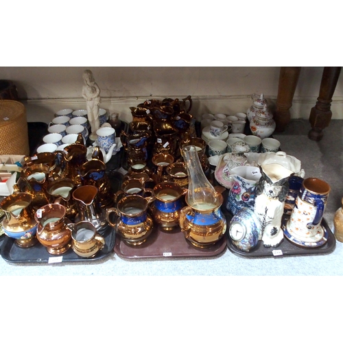 204 - A quantity of copper lustre pottery jugs, blue chintz printed mugs, wally dog jug and other items