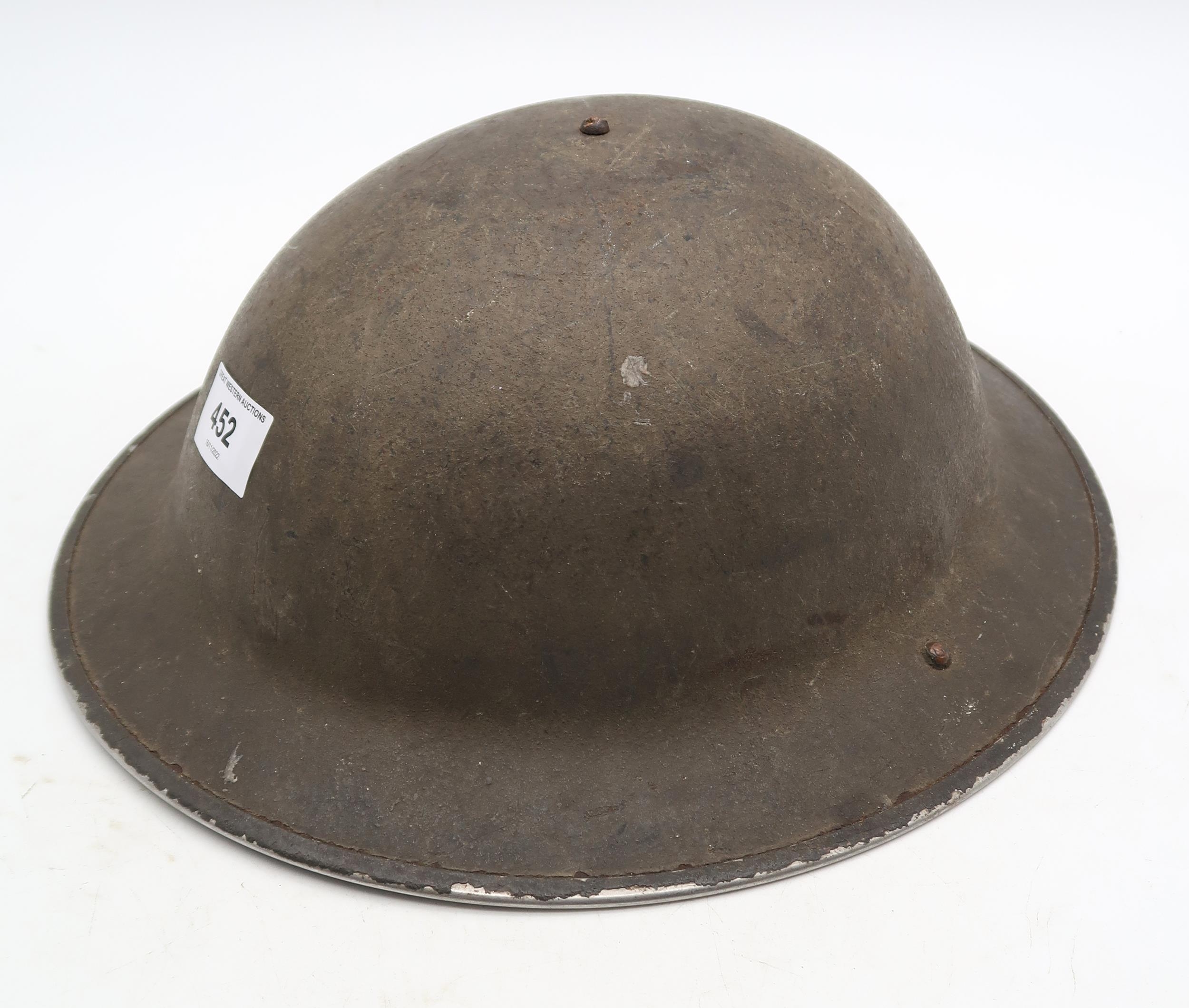 A British WW2 Brodie helmet lacking liner