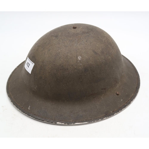 A British WW2 Brodie helmet lacking liner