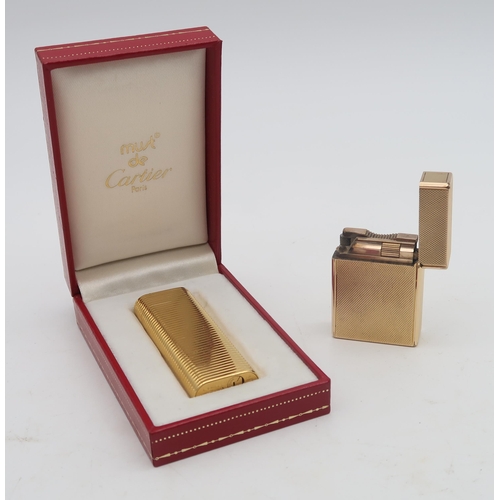 465 - A boxed Cartier Plaque d'Or cigarette lighter, the lid engraved 