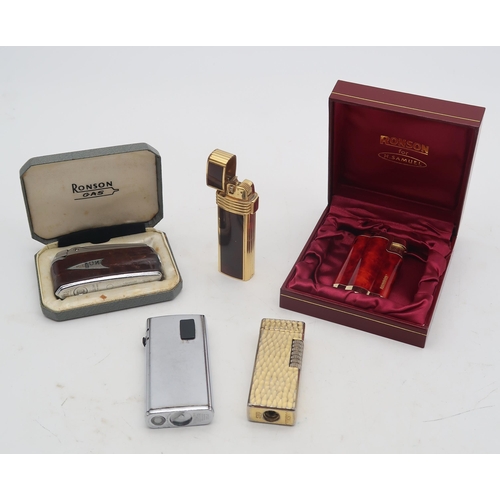 466 - A Christian Dior cigarette lighter, together with four other various lighters, mainly Ronson