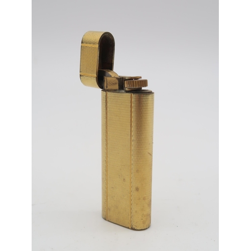 467 - A Cartier Plaque d'Or gold-plated cigarette lighter