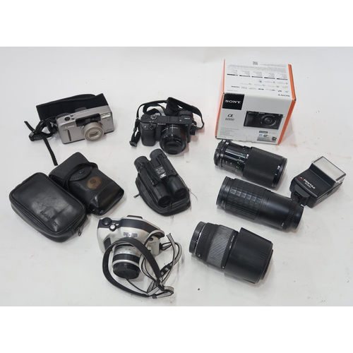 512 - Assorted contemporary camera equipment, to include a Sony CX 6000 digital camera, lenses by Pentax a... 