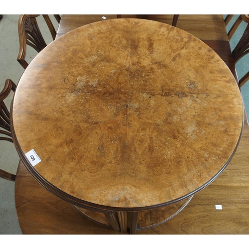 109 - A 20th century burr walnut quarter veneered circular nesting table, 51cm high x 61cm diameter