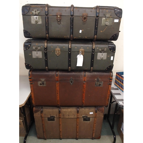114 - A lot of four assorted wood bound travel trunks (4)