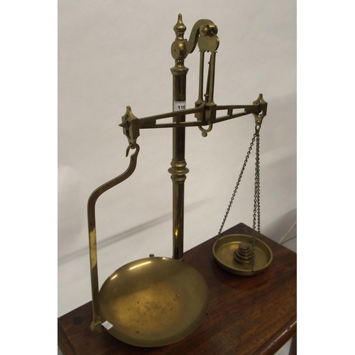 116 - A 20th century mahogany circular nesting table, table scales and a brass and ceramic table lamp (3)