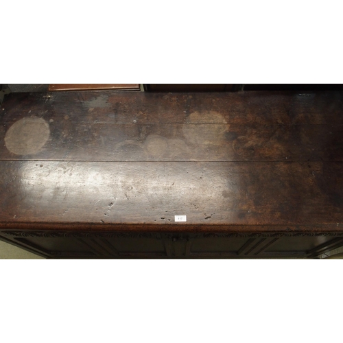 117 - A 19th century oak baronial style panel front kist, 68cm high x 153cm wide x 61cm deep