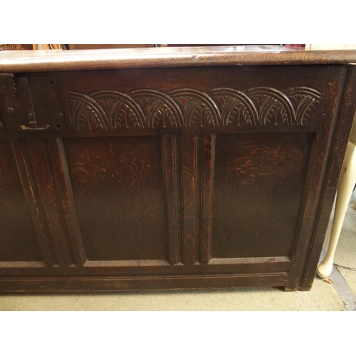 117 - A 19th century oak baronial style panel front kist, 68cm high x 153cm wide x 61cm deep